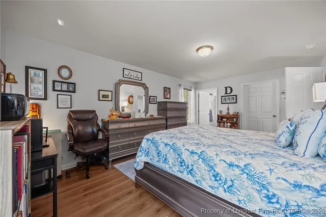 a bedroom with a bed and furniture