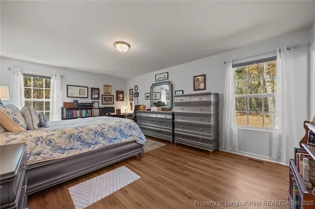 a bedroom with a bed closet and a window