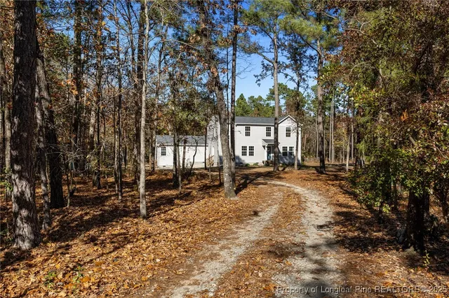 a house with trees in the background