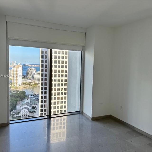 68 Southeast 6th Street, Unit 2507 Miami, FL 33131 - Photo 18 of 47 a view of an empty room with a window