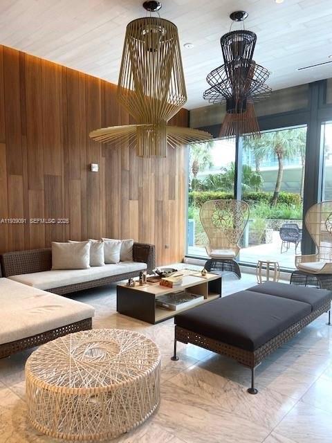 68 Southeast 6th Street, Unit 2507 Miami, FL 33131 - Photo 37 of 47 a living room with furniture and a large window