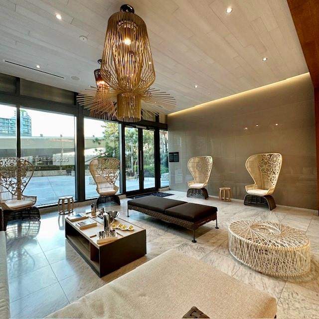 68 Southeast 6th Street, Unit 2507 Miami, FL 33131 - Photo 38 of 47 a living room with furniture and a large window