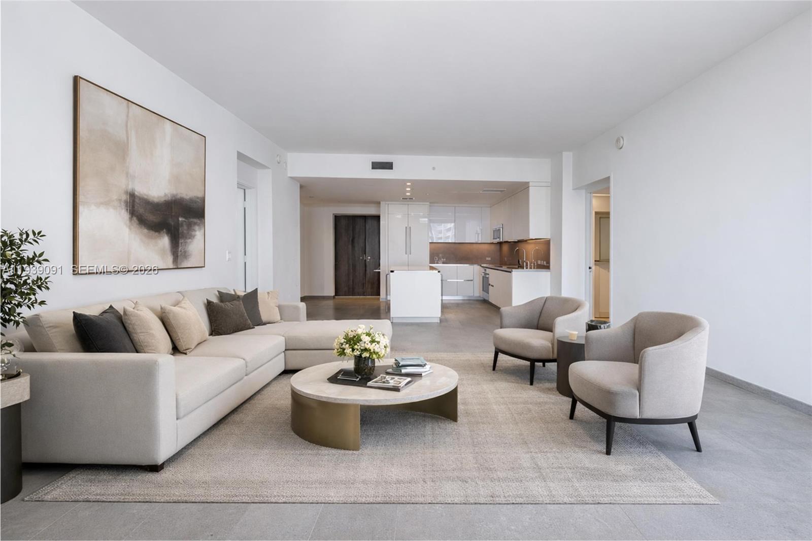 68 Southeast 6th Street, Unit 2507 Miami, FL 33131 - Photo 5 of 47 a living room with furniture and white walls