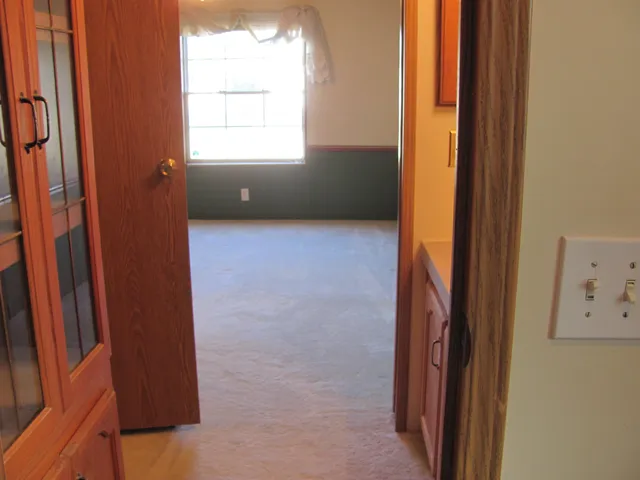 a view of a wooden deck with a yard