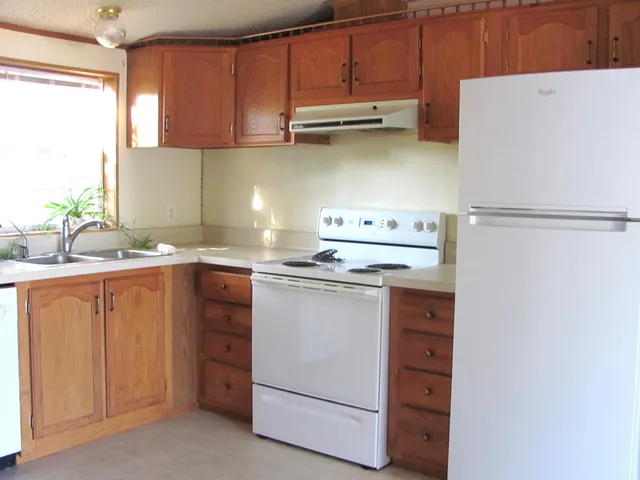 a kitchen with stainless steel appliances a refrigerator and a sink