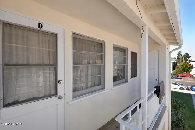 a view of an entryway with wooden floor and door