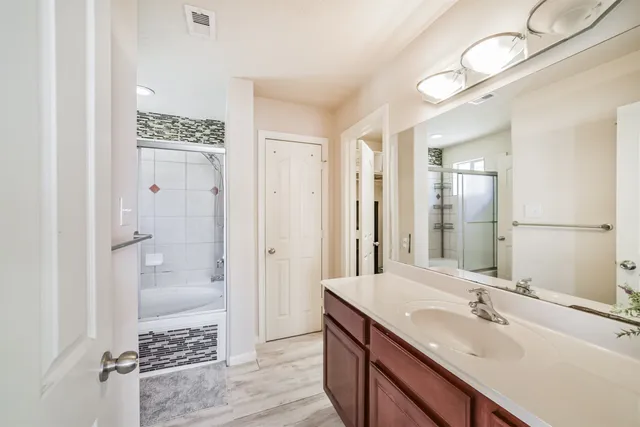 a bathroom with a sink and a mirror