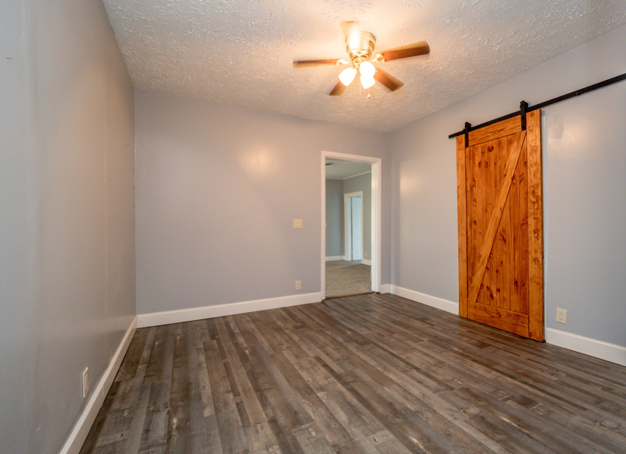 225 Paul Thompson Road Bethpage, TN 37022 - Photo 8 of 14 a view of an empty room with a window and wooden floor