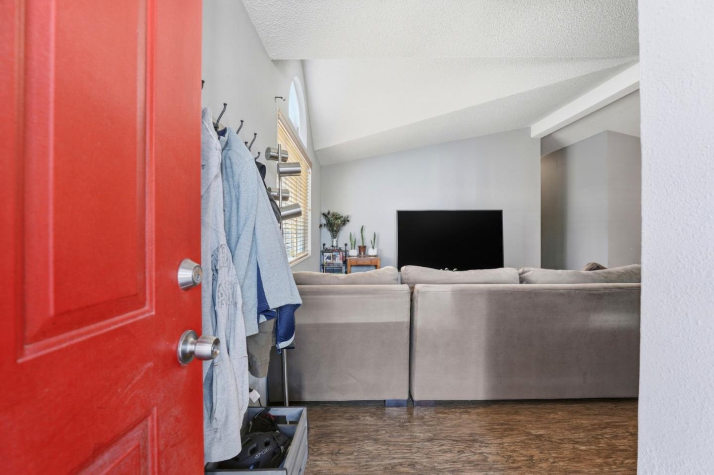 20 Russell Road, Unit 8 Salinas, CA 93906 - Photo 4 of 38 a living room with a flat screen tv and a couch