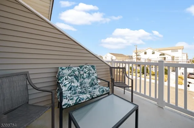 a view of a balcony with furniture