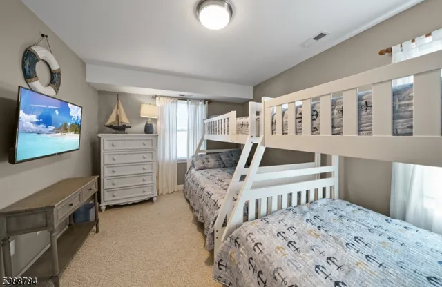 a bedroom with a bed and a table in it