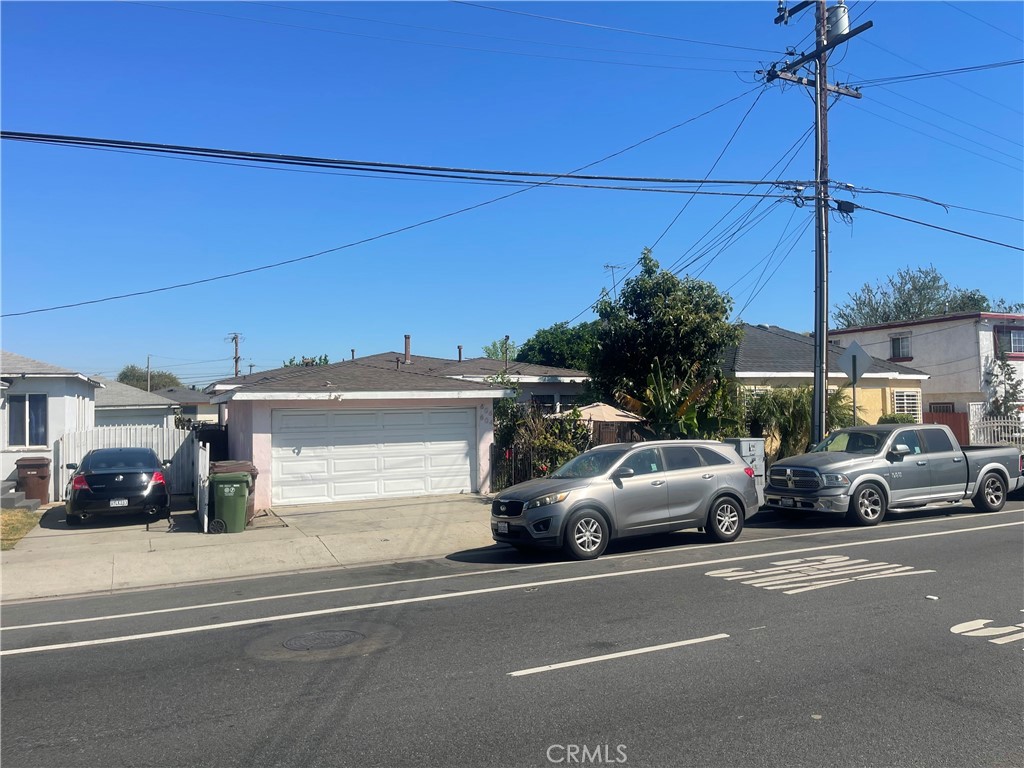 a view of a car parked on the side of a street