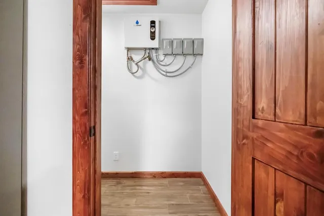 a view of an entryway with wooden floor