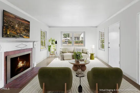 a dining room with furniture a fireplace and wooden floor