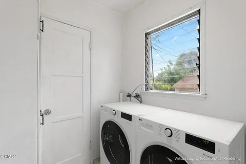 a utility room with dryer and washer