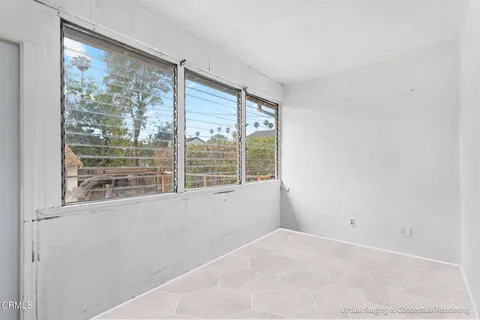 a view of an empty room with a window