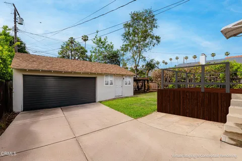 a front view of a house with garage