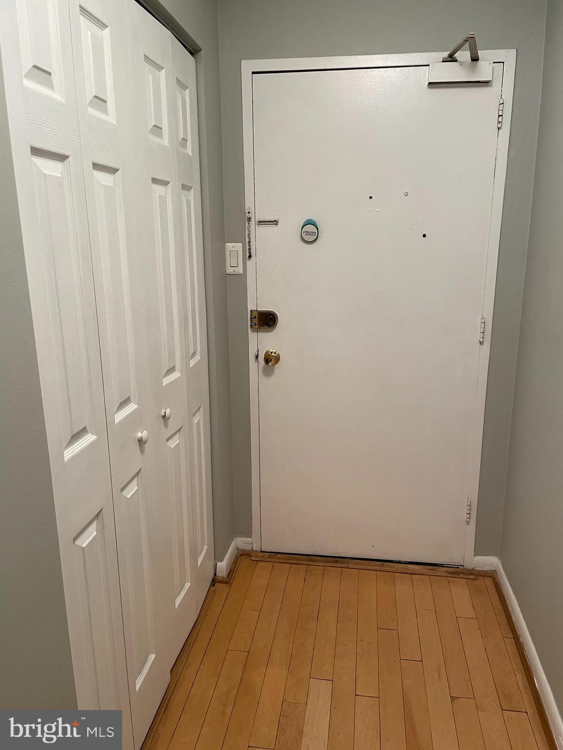 8315 North Brook Lane, Unit 21004 Bethesda, MD 20814 - Photo 3 of 12 a view of a hallway with wooden floor