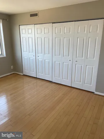 a view of a livingroom with wooden floor