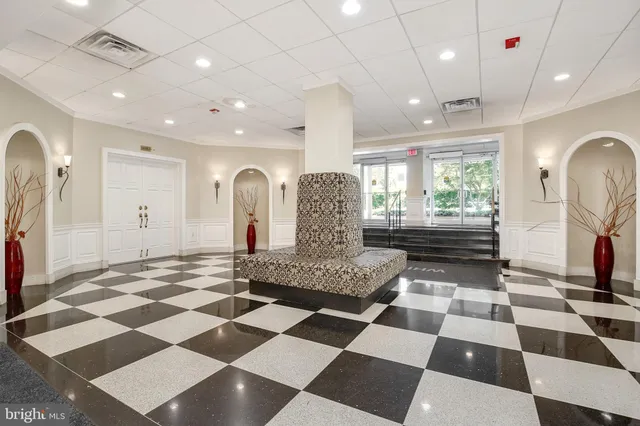 a view of a room with a black and white checkered floor
