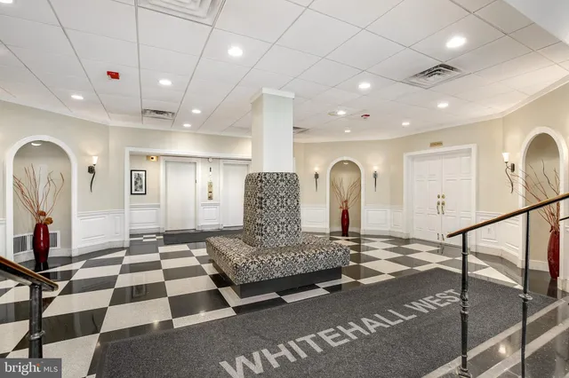 a couple of cars parked in front of building