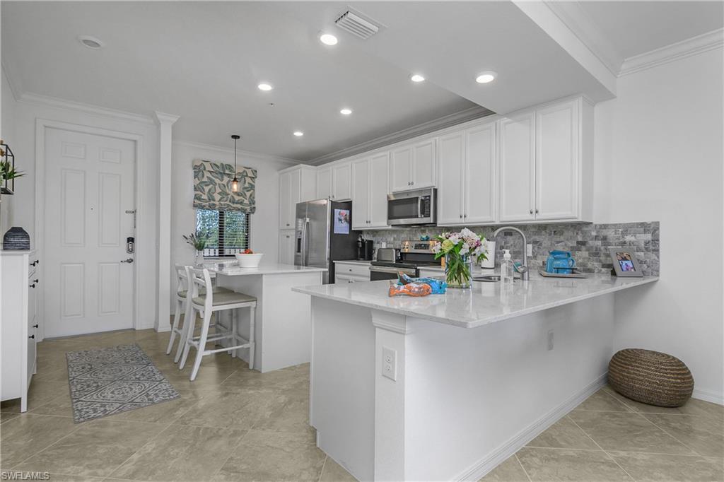 9572 Trevi Court, Unit 5034 Naples, FL 34113 - Photo 2 of 47 Kitchen