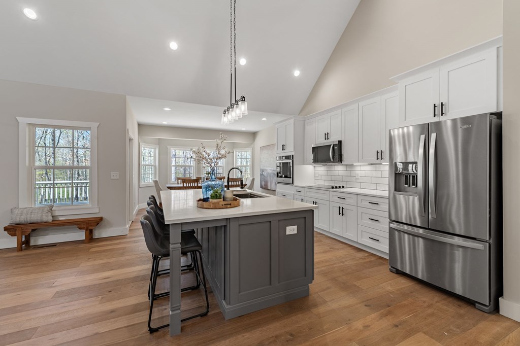 219 Fairview Drive Morganton, GA 30560 - Photo 13 of 61 a kitchen with stainless steel appliances a table chairs wooden floors and a view of kitchen