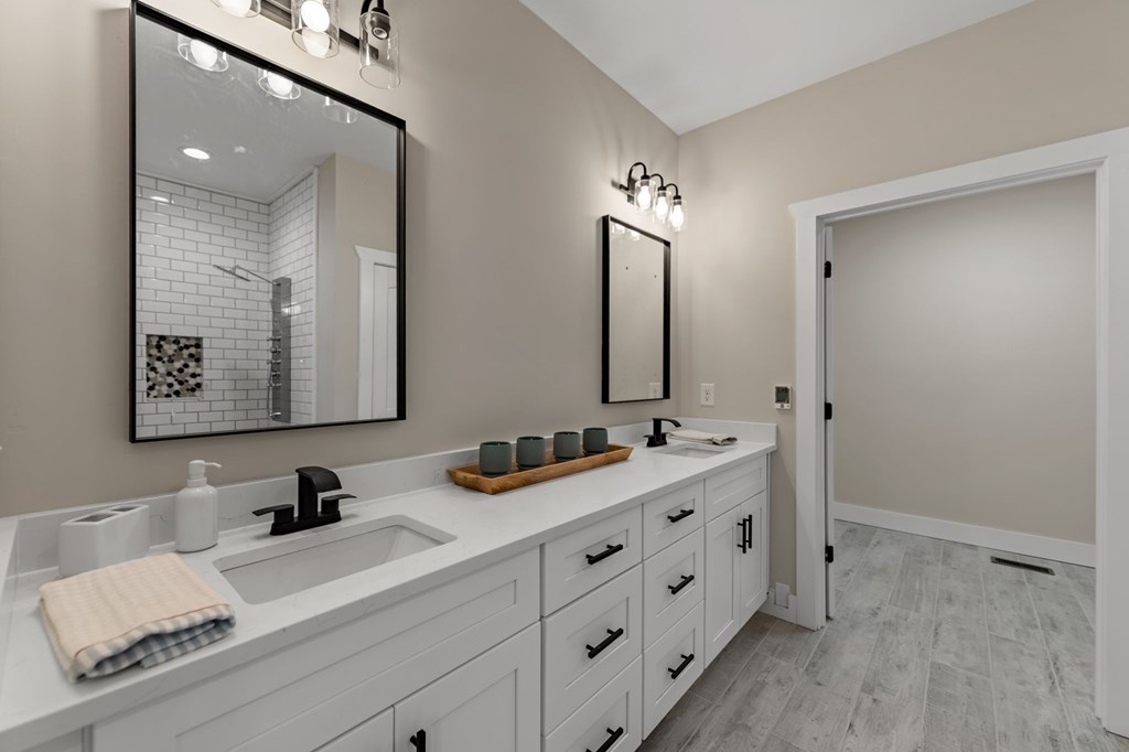 219 Fairview Drive Morganton, GA 30560 - Photo 29 of 61 a bathroom with a double vanity sink and mirror