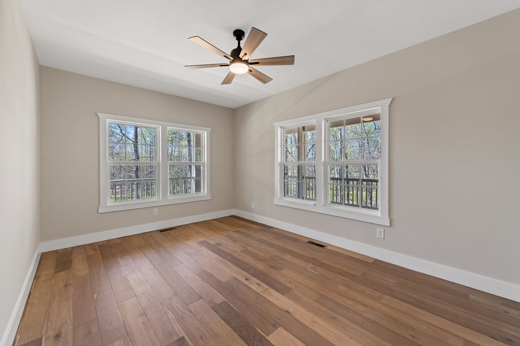 219 Fairview Drive Morganton, GA 30560 - Photo 38 of 61 a view of an empty room with wooden floor and a window