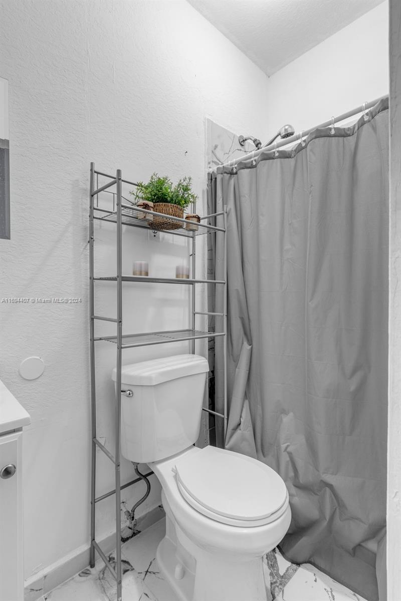 2012 Southeast 15th Street, Unit 1 Homestead, FL 33035 - Photo 12 of 12 a bathroom with a toilet and a shower
