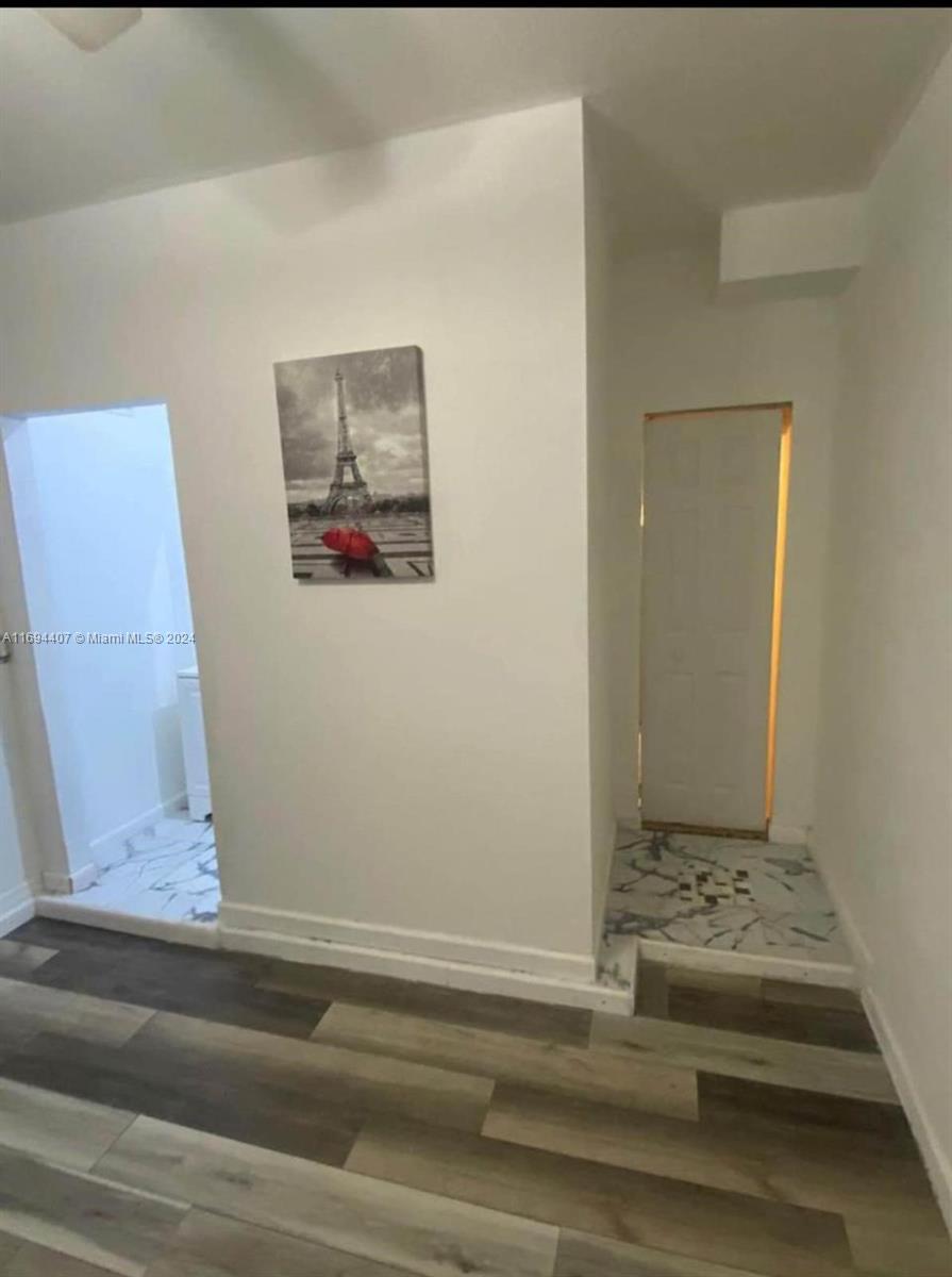 2012 Southeast 15th Street, Unit 1 Homestead, FL 33035 - Photo 3 of 12 a view of a hallway