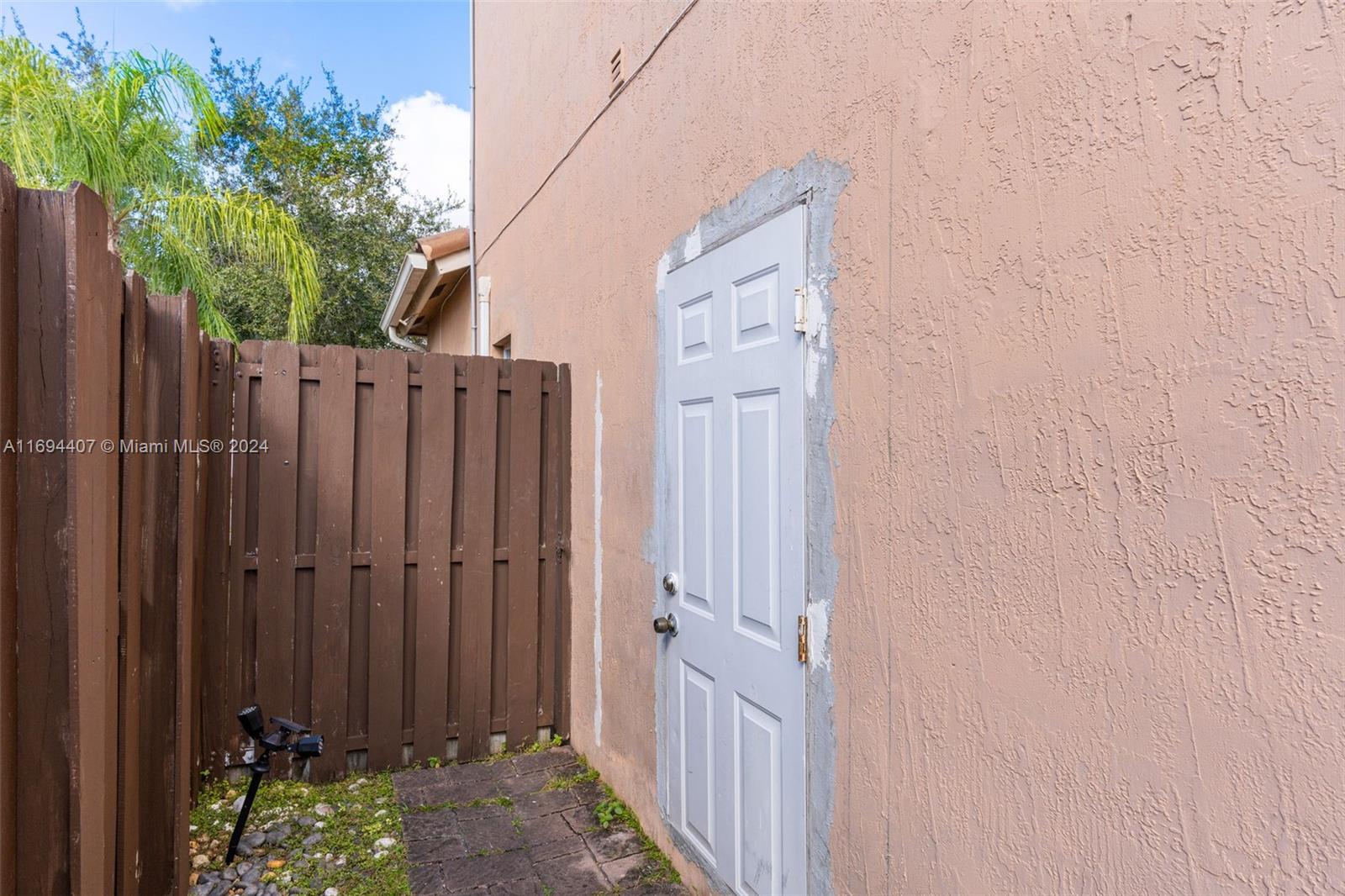 2012 Southeast 15th Street, Unit 1 Homestead, FL 33035 - Photo 9 of 12 a view of a wooden fence