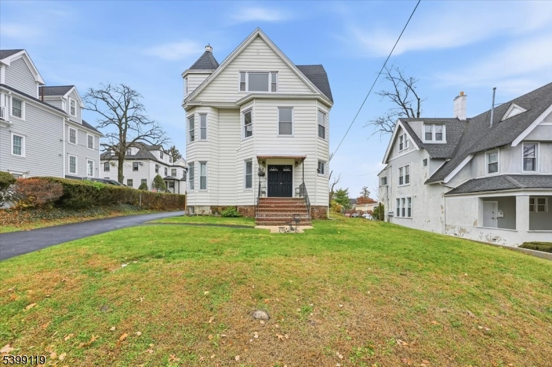 a front view of a house with a yard