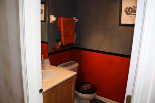 114 Barnes Road Elgin, IL 60124 - Photo 11 of 15 a bathroom with a toilet and a sink