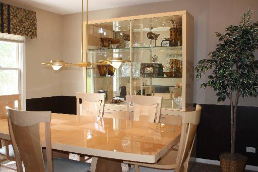 114 Barnes Road Elgin, IL 60124 - Photo 5 of 15 a dining room with furniture and chandelier