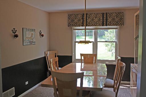 114 Barnes Road Elgin, IL 60124 - Photo 6 of 15 a view of a dining room with furniture window and outside view