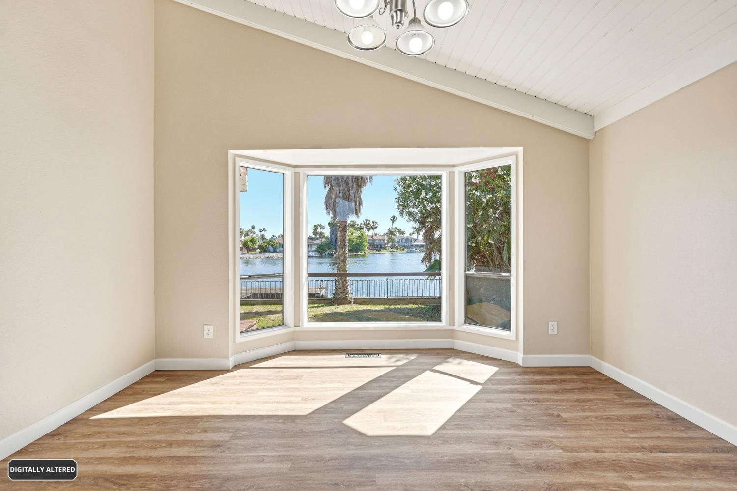 5501 Riverlake Road Discovery Bay, CA 94505 - Photo 15 of 60 a view of a room with wooden floor and windows