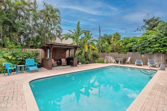 a view of a swimming pool with lounge chair