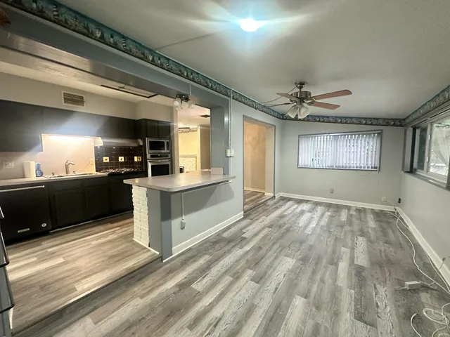 a view of an empty room and a windows