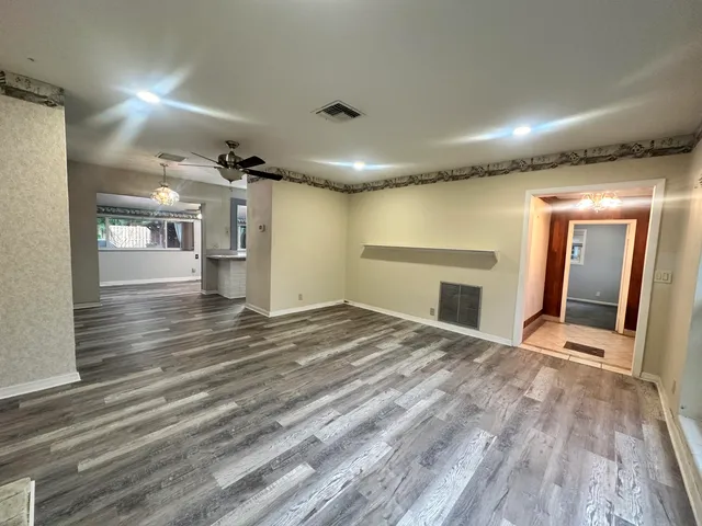 a view of a hallway with washer and dryer