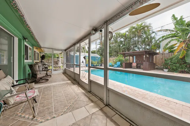 a view of swimming pool with outdoor seating