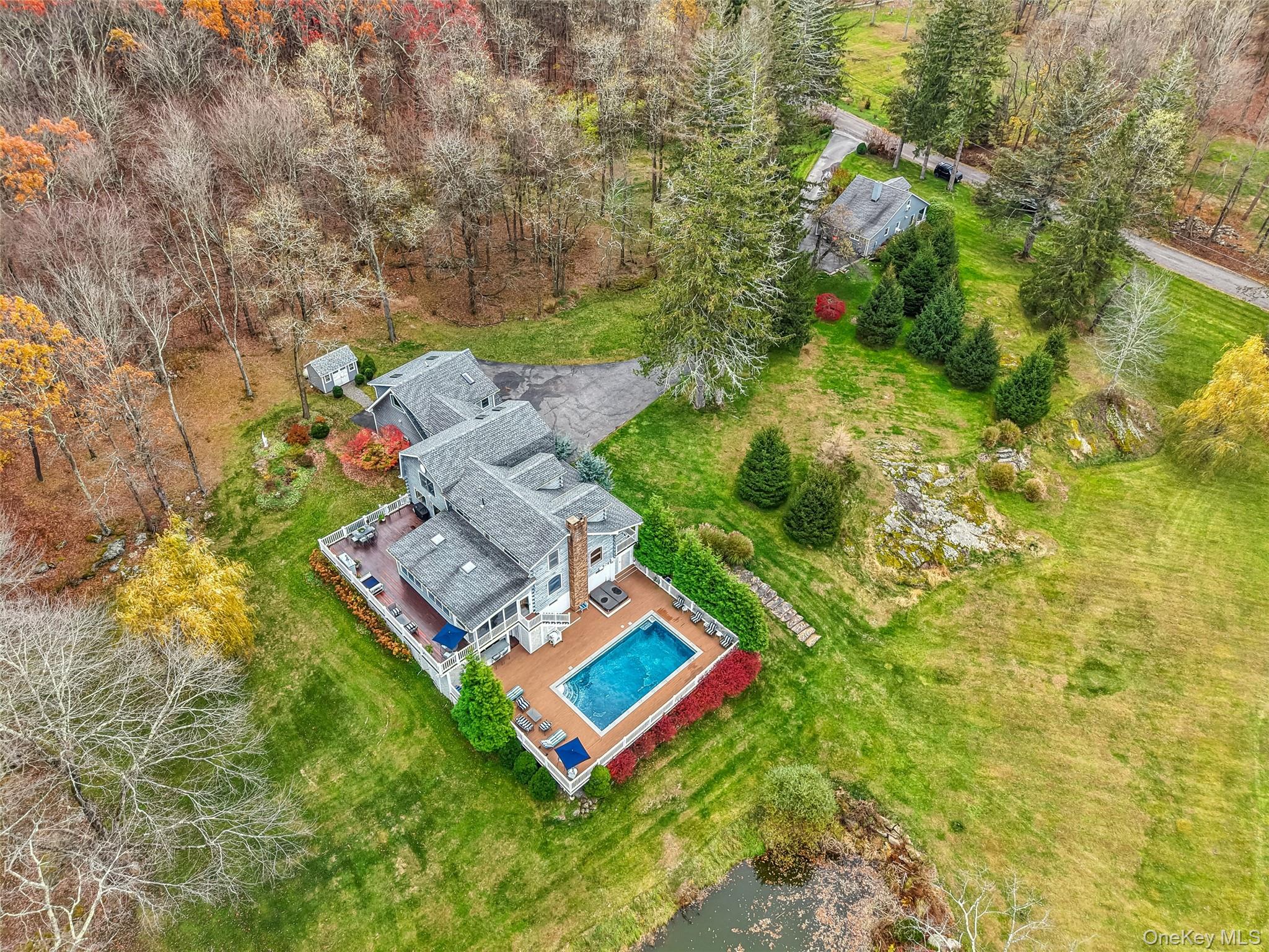 43 Meeting House Road Pawling, NY 12564 - Photo 44 of 46 Aerial view of Cattage house, Main house with pool deck and entertaining deck, pond and shed.