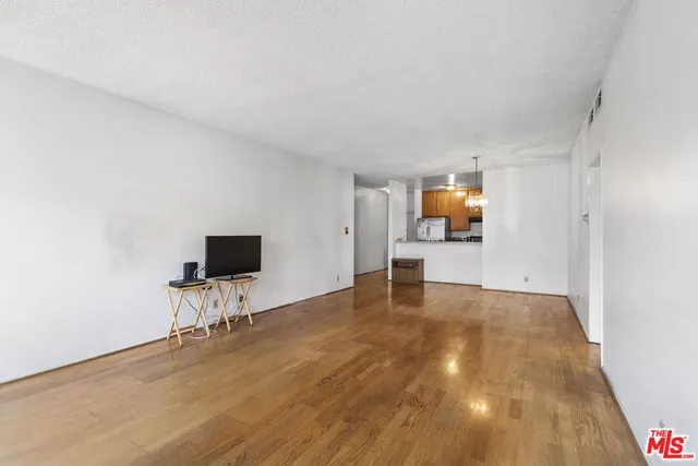 a view of room with wooden floor and chair