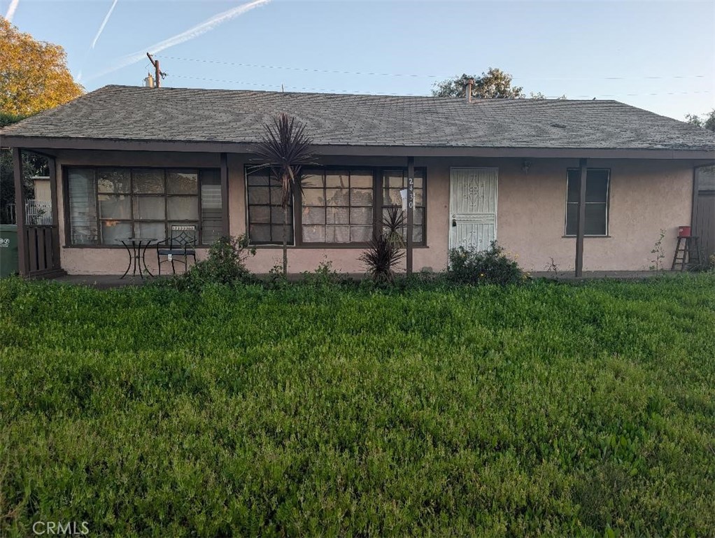 2430 West Bennett Street Compton, CA 90220 - Photo 1 of 1 a view of a house with a garden