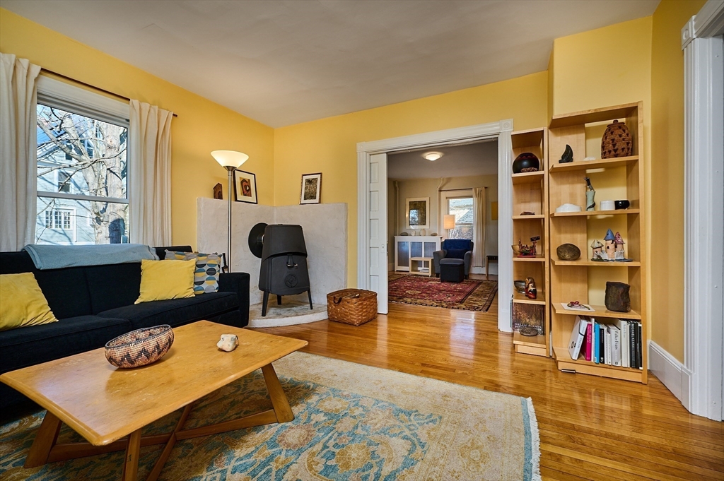 16 South Sunset Avenue Amherst, MA 01002 - Photo 13 of 42 a living room with furniture and a book shelf
