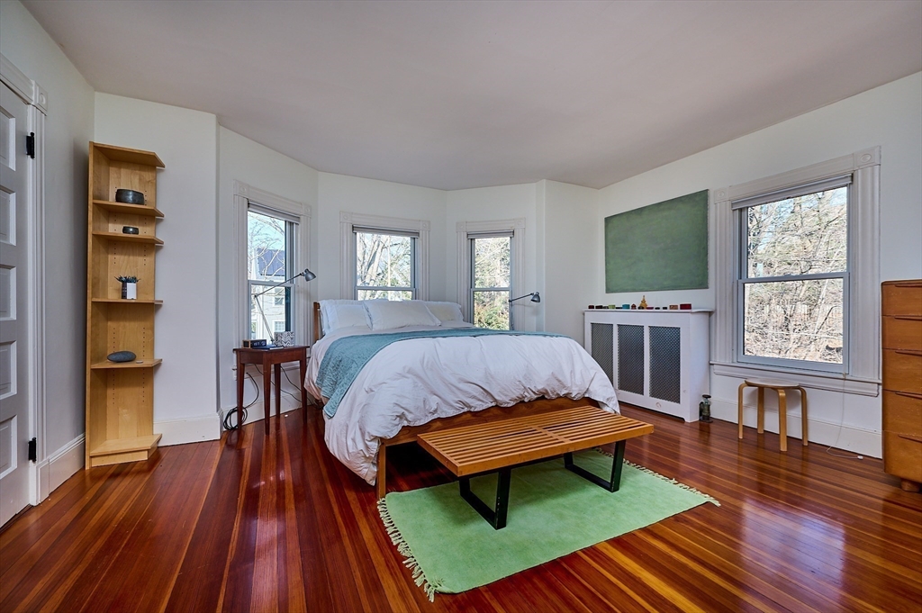 16 South Sunset Avenue Amherst, MA 01002 - Photo 18 of 42 a bedroom with a bed window and a table