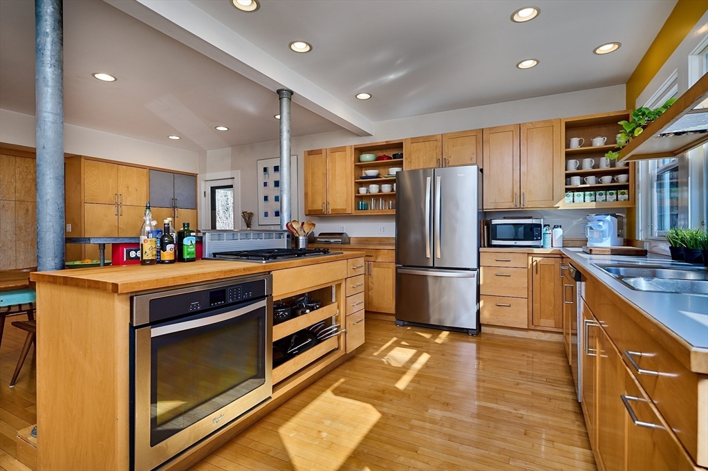 16 South Sunset Avenue Amherst, MA 01002 - Photo 7 of 42 a kitchen with stainless steel appliances granite countertop a stove refrigerator and a sink