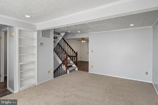 a view of a hallway with staircase