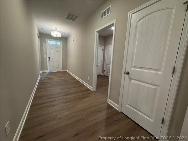 a large kitchen with kitchen island a sink stainless steel appliances and cabinets