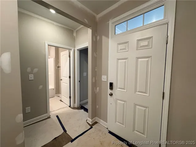 a view of hallway with windows